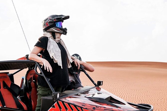 Vip Evening Desert Safari with quad bike,Camel Riding & Dinner - Sandboarding and the sunset photo stop